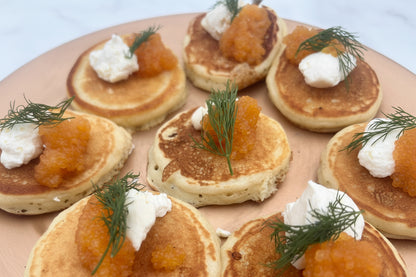 Blinis with Whitefish Caviar and dill on a plate. 